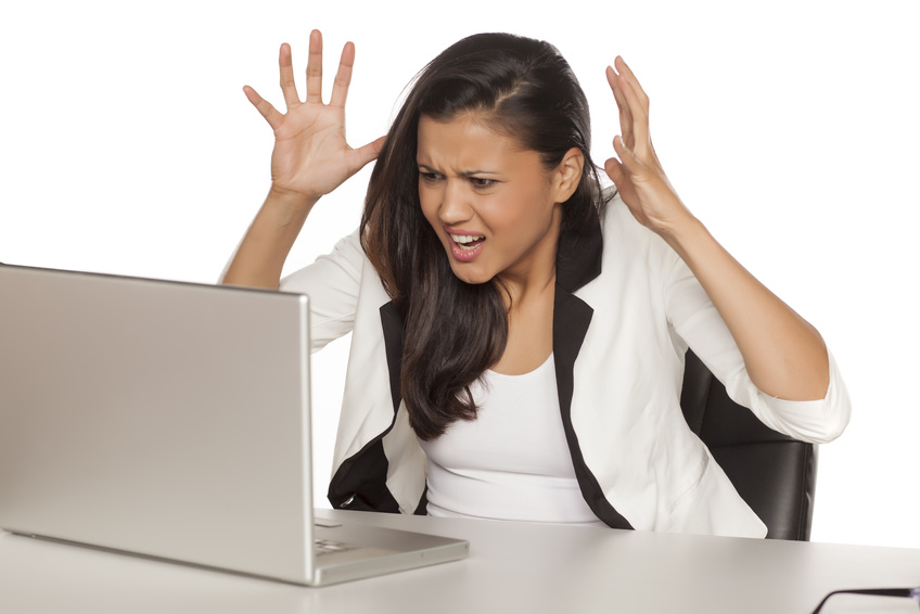 angry business woman screaming at her laptop angry business woman screaming at her laptop
